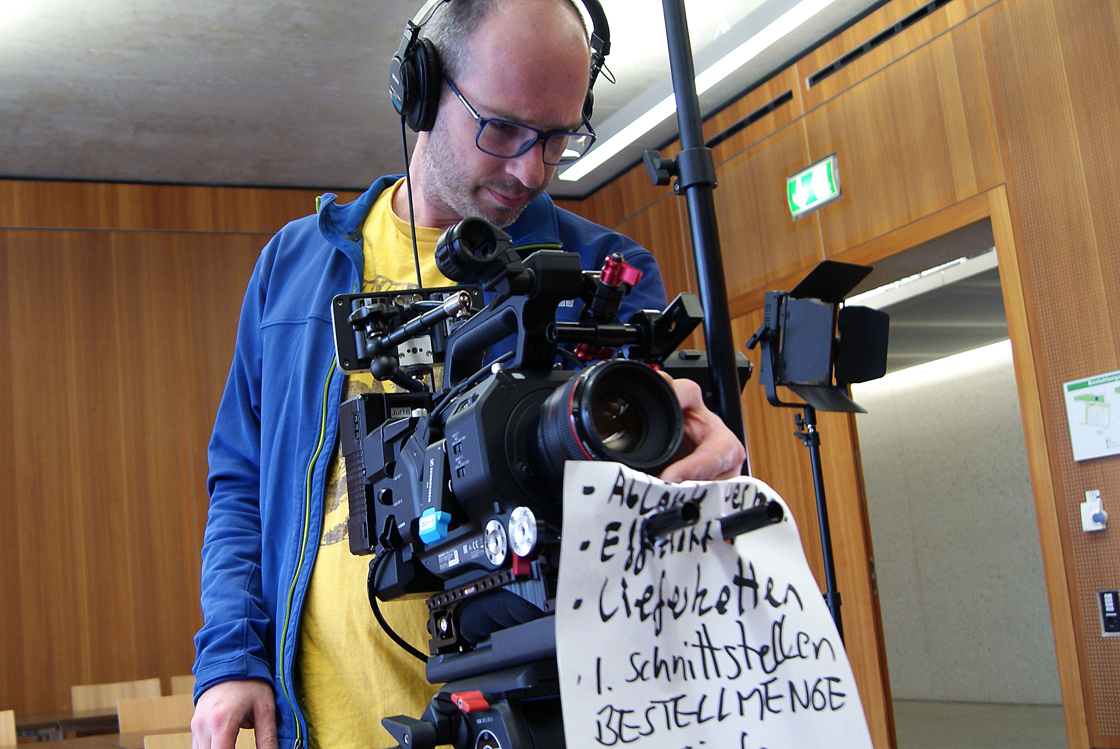 A cameraman in action: filming an online lecture